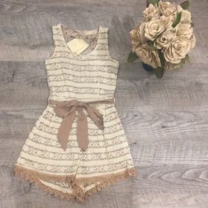 Sleeveless romper with lace tie